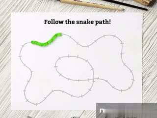 A printed activity page from the book, laid out on the table